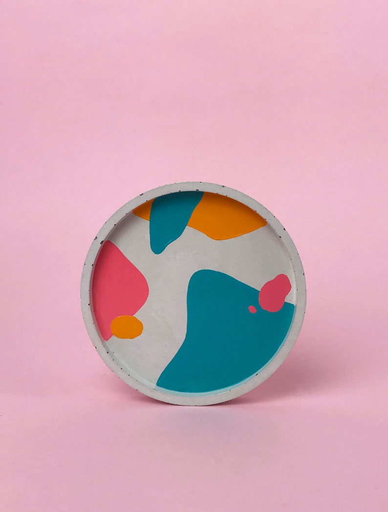 Round concrete trinket dish with multi-coloured abstract pattern image 1
