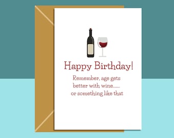 May include: A white card with a red border and red text that reads "Happy Birthday! Remember, age gets better with wine...... or something like that". A cartoon image of a bottle of wine and a glass of wine are on the card.