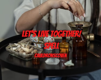 May include: A table with a variety of items, including a small box with a floral design, a small bowl with mushrooms, a mortar and pestle, and several bottles. The text "Let's Live Together! Spell Cauldronscoven" is written on the table.