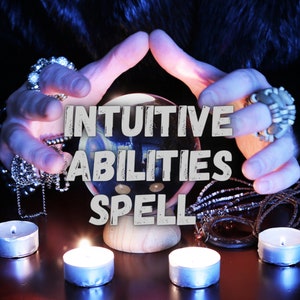 May include: A crystal ball with the text "Intuitive Abilities Spell" on it, surrounded by candles and beads. The hands of a person are holding the crystal ball.
