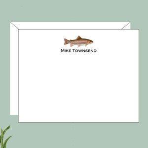 May include: A white card with a brown and red trout illustration and the text "Mike Townsend" printed in black.