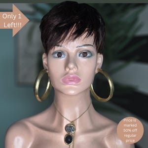 May include: A mannequin head with short dark hair and large gold hoop earrings. A gold necklace with two pendant stones hangs around the neck. The text "Only 1 Left!!!" is in the upper left corner.