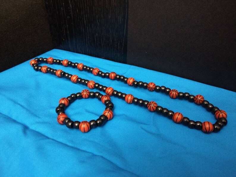 A103 Unisex basketball bracelet and necklace set.