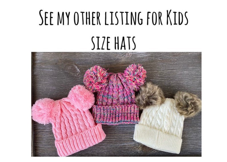 May include: Three knitted winter hats with pom-poms. One is pink, one is multicolored, and one is white. The hats are displayed on a dark wood surface. Text at the top reads: "SEE MY OTHER LISTING FOR KIDS SIZE HATS."