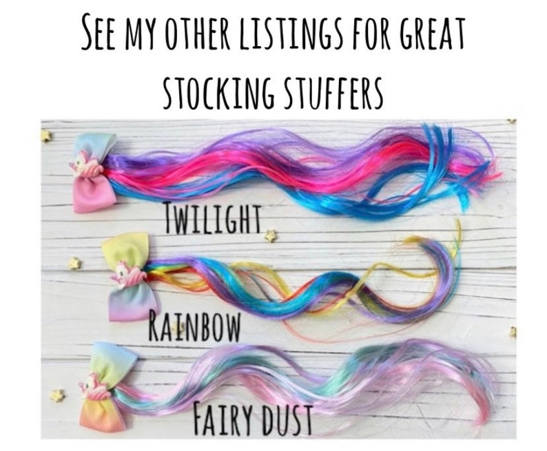 May include: Colorful hair extensions in Twilight, Rainbow, and Fairy Dust colors. Each extension is attached to a bow with a unicorn charm. The text at the top says "See my other listings for great stocking stuffers."