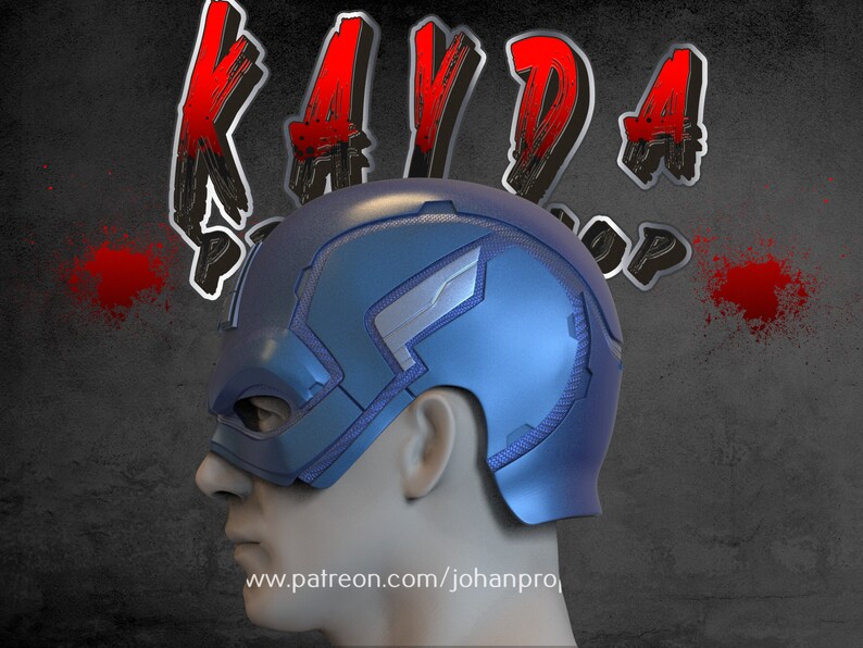 Op de afbeelding: Een blauwe en zilveren Captain America helm met een gestructureerd oppervlak. De helm zit op een mannequinhoofd en de tekst "www.patreon.com/johanpro" is zichtbaar onderaan de afbeelding.