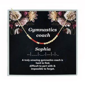May include: A gold necklace with red beads spelling out the word "Sophia" on a black background with the text "Gymnastics coach" and a quote about how amazing gymnastics coaches are.