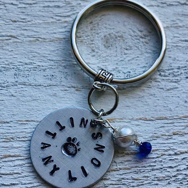 NITTANY LIONS (Penn State) Hand-Stamped 1” Pendant Key Charm (Aluminum) with Silver-Wrapped Blue and White Beaded Charm on Silver Bail.
