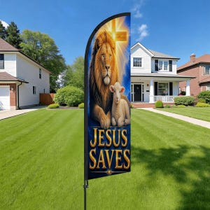 May include: A vertical flag featuring a lion and a lamb with a cross in the background. The words "JESUS SAVES" are displayed in gold lettering on a blue banner. The flag is set up on a green lawn in front of a house.