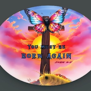 May include: A colorful butterfly with pink, blue, and yellow wings sits on a wooden cross against a sunset sky. The text "You must be born again" is written below the cross, with the scripture reference "John 3:7" underneath.