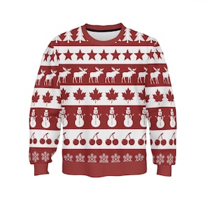 May include: A long-sleeve crewneck sweatshirt featuring a repeating horizontal pattern in red and white. The design includes rows of pine trees, stars, moose, maple leaves, snowmen, cherries, and snowflakes arranged in distinct bands across the fabric.