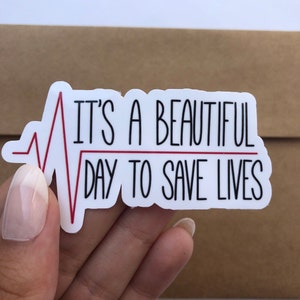 It's A Beautiful Day to Save Lives Grey's Anatomy Glossy Waterproof Vinyl Sticker | Laptop and Water Bottle Tv Series Stickers