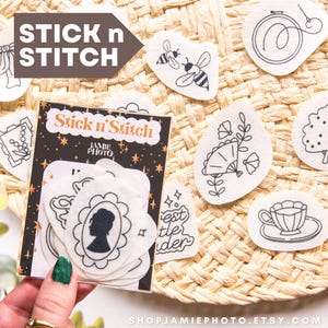 May include: A collection of Stick n Stitch embroidery patches with various designs, including a bow, bees, a teacup, and a tree. The patches are white with black line art. The packaging reads "Stick n Stitch" and "Jamie Photo".