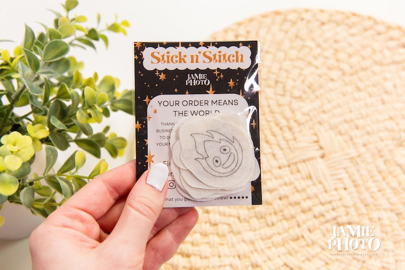 May include: A package of white fabric patches with a black and gold design. The package says "Stick n' Stitch" and "Your order means the world".