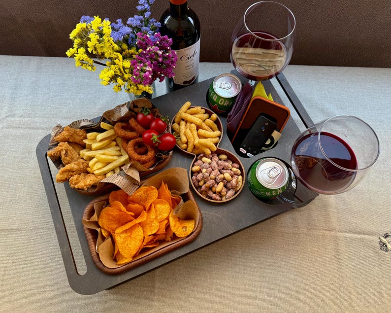 Cozy home decor featuring a custom snack board on couch armrest