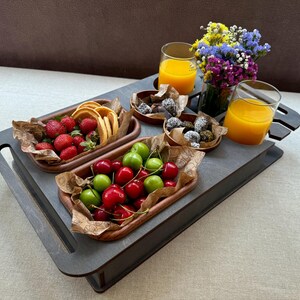 Personalized couch tray with custom name, drink holders, and holiday setup