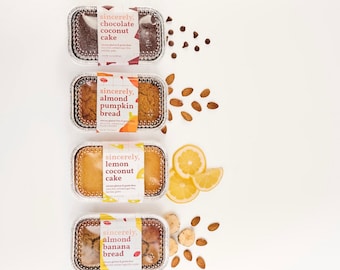 May include: Four loaf pans with different flavors of baked goods. The top pan has chocolate coconut cake, the second pan has almond pumpkin bread, the third pan has lemon coconut cake, and the bottom pan has almond banana bread. Each pan has a label with the name of the baked good and the words "sincerely" and "allergen & gluten free".