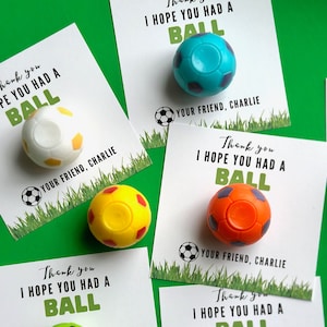 May include: Five thank you cards with a soccer ball theme. Each card has a different colored soccer ball attached to it. The cards say "Thank you I hope you had a ball" and "Your friend, Charlie".