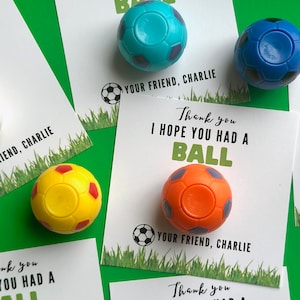 May include: Four thank you cards with a soccer ball theme. Each card has a different colored soccer ball attached to it. The cards say "Thank you I hope you had a ball" and "Your friend, Charlie".