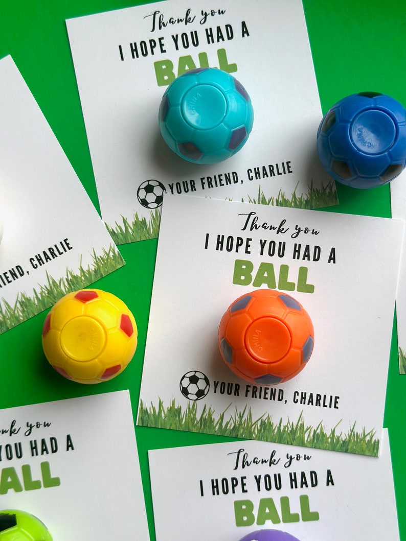 May include: Four thank you cards with a soccer ball theme. Each card has a different colored soccer ball attached to it. The cards say "Thank you I hope you had a ball" and "Your friend, Charlie".