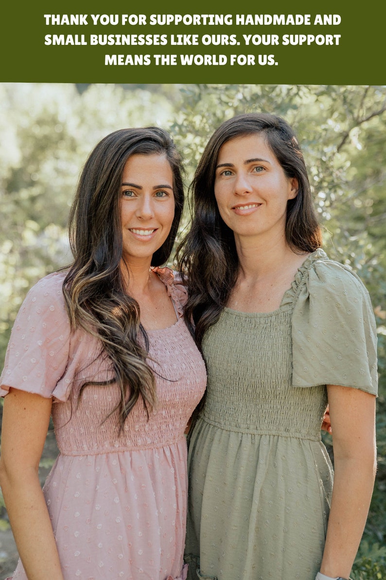 May include: Two women wearing pink and green dresses stand in front of a green leafy background. The women are smiling and looking at the camera. The text "THANK YOU FOR SUPPORTING HANDMADE AND SMALL BUSINESSES LIKE OURS. YOUR SUPPORT MEANS THE WORLD FOR US." is displayed above the women.