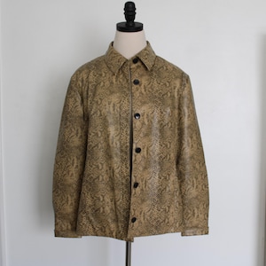 May include: A brown faux snakeskin jacket with a button-up front and long sleeves.
