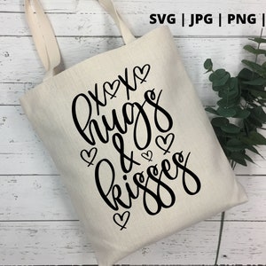 K&ouml;nnte beinhalten: Eine wei&szlig;e Einkaufstasche mit schwarzem Text, der "Hugs & Kisses" mit Herzen um den Text herum lautet.