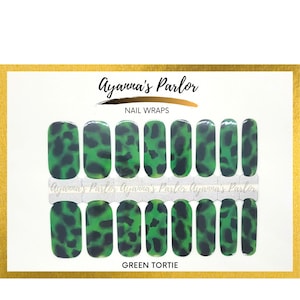 May include: Green tortoise shell nail wraps with a black background. The nail wraps are arranged in two rows of five. The text "Ayanna's Parlor" and "Nail Wraps" are at the top of the image. The text "Green Tortie" is at the bottom of the image.