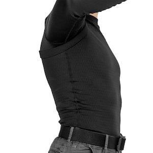 May include: A black long-sleeved shirt with a built-in concealed carry holster. The shirt is made of a breathable, moisture-wicking fabric and features a comfortable fit.