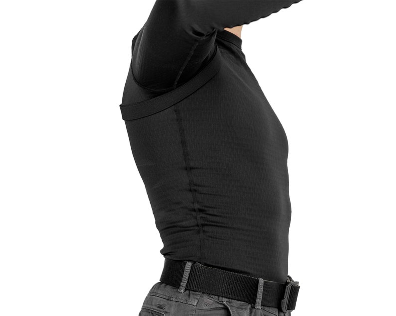 May include: A black long-sleeved shirt with a built-in concealed carry holster. The shirt is made of a breathable, moisture-wicking fabric and features a comfortable fit.