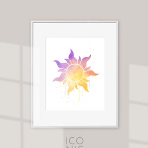 Puede incluir: Impresión artística enmarcada con un diseño de sol estilizado en tonos amarillos, naranjas y morados. El sol tiene un efecto de acuarela con detalles de pintura goteando. La impresión está en un marco blanco, con el texto "ICONIC watercolors" en la parte inferior.
