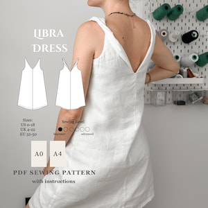 May include: A white linen dress with a V-neck and a low back is shown. The image includes a sewing pattern with the text "LIBRA DRESS" and size information for US, UK, and EU sizes. The pattern is a PDF with instructions.