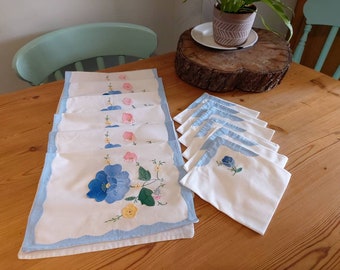 Vintage Beautiful appliqué tray/table mats with matching napkins. Six in each set. Very fresh and clean