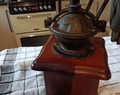 Vintage unusual spinning coffee grinder sourced in France cast iron decorative top wooden base country kitchen display unusual gift