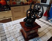 Vintage unusual spinning wheel coffee grinder sourced in France cast iron decorative wooden base with drawer display daily use kitchen