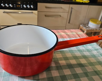 Medium vintage red with black trim.A An enameled  handle  quality item very good condition would suit sauces and milk