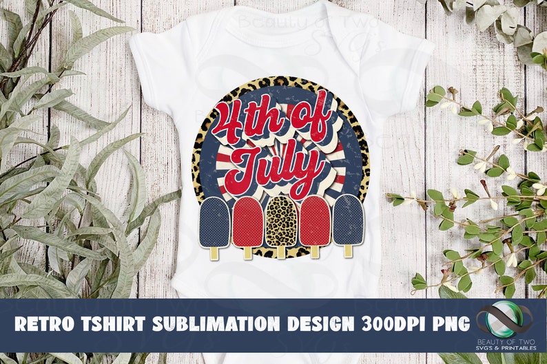 May include: A white t-shirt with a red, white, and blue 4th of July design featuring a circle with a starburst pattern and the text "4th of July".  Five popsicle-shaped graphics are arranged below the circle, with red, white, and blue colors.