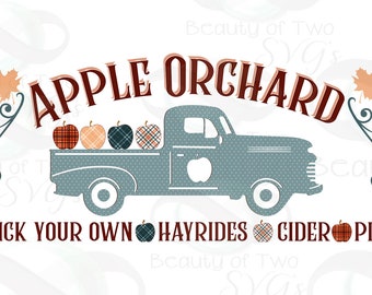 May include: A vintage blue pickup truck with a white apple logo on the side. The truck bed is filled with four red, orange, and plaid apples. The text "APPLE ORCHARD" is above the truck and "PICK YOUR OWN HAYRIDES CIDER PIE" is below the truck.