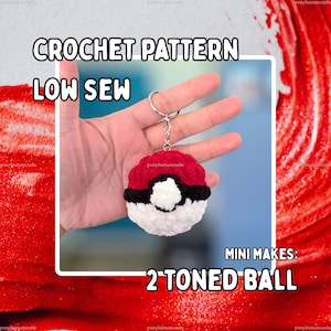 May include: A crochet keychain featuring a spherical design with a red top half, a white bottom half, and a black horizontal band with a central white circle. The text CROCHET PATTERN LOW SEW and MINI MAKES: 2 TONED BALL is visible on the image.