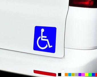 May include: Blue square sticker with a white wheelchair accessibility symbol. The symbol is a white wheelchair with a person sitting in it.