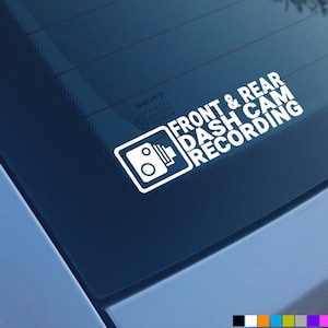 May include: White sticker on a blue car window that says "Front & Rear Dash Cam Recording" with a camera icon.