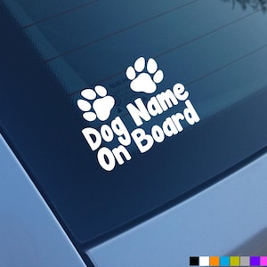 May include: White vinyl car sticker with two paw prints and the text "Dog Name On Board".