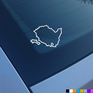 May include: A white outline of the state of Texas on a blue car window.