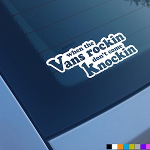 May include: White vinyl sticker with the text "When the Vans rockin' don't come knockin'" on a blue car window.