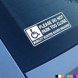 May include: White sticker with a wheelchair symbol and the text "Please do not park too close. Mobility scooter access required."