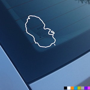 May include: A white outline of an island shape on a blue car window.