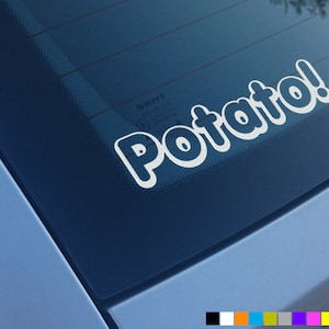 May include: White vinyl sticker with the word "Potato!" in a rounded, bubbly font on a blue car window.