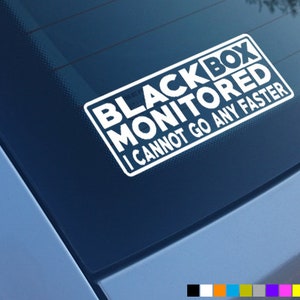 May include: White sticker with the text "Black Box Monitored I Cannot Go Any Faster" on a blue car window.