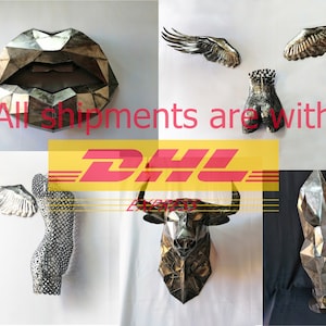 May include: A collection of six metal sculptures, including a pair of wings, a bull's head, a human torso, a pair of wings, a geometric shape, and a pair of lips. All shipments are with DHL.