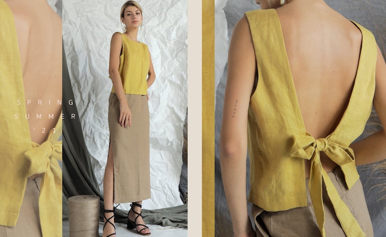 May include: A yellow linen sleeveless top with a bow tie detail in the back. The top is cropped and has a relaxed fit.